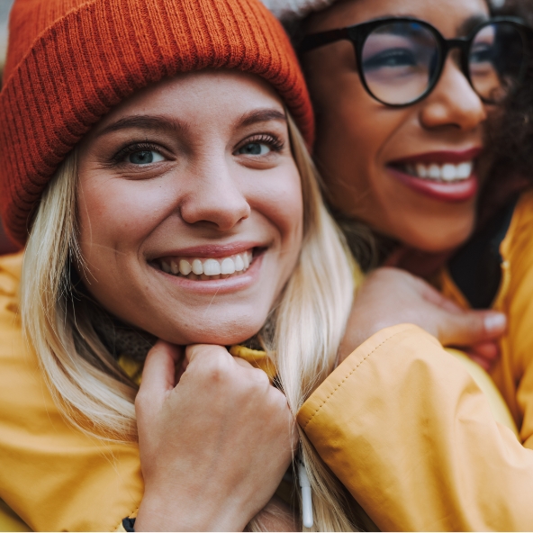 Two culturally diverse women smiling Two culturally diverse women smiling