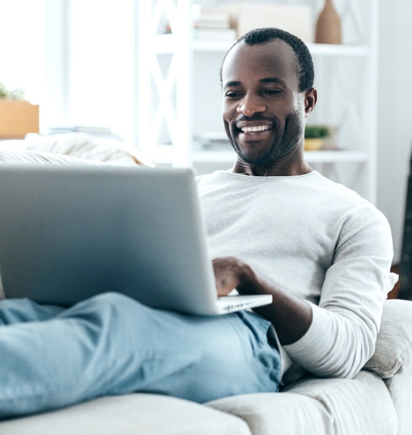 Happy man receiving mental health services online