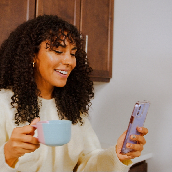 Young woman receiving mental health treatment on her phone Young woman receiving mental health treatment on her phone